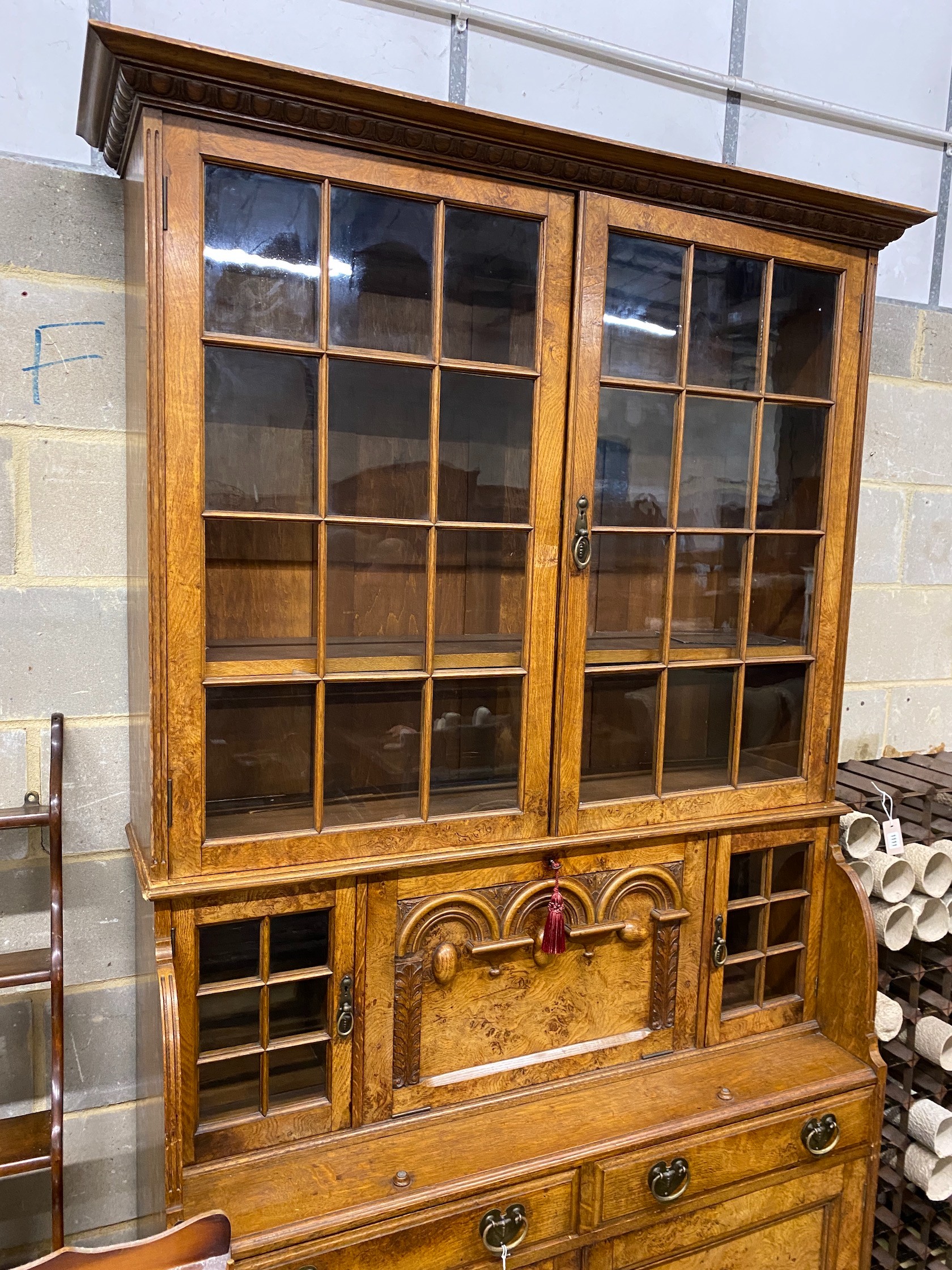 Lamb of Manchester. A late Victorian oak and pollard oak secretaire bookcase, width 125cm, depth 46cm, height 226cm